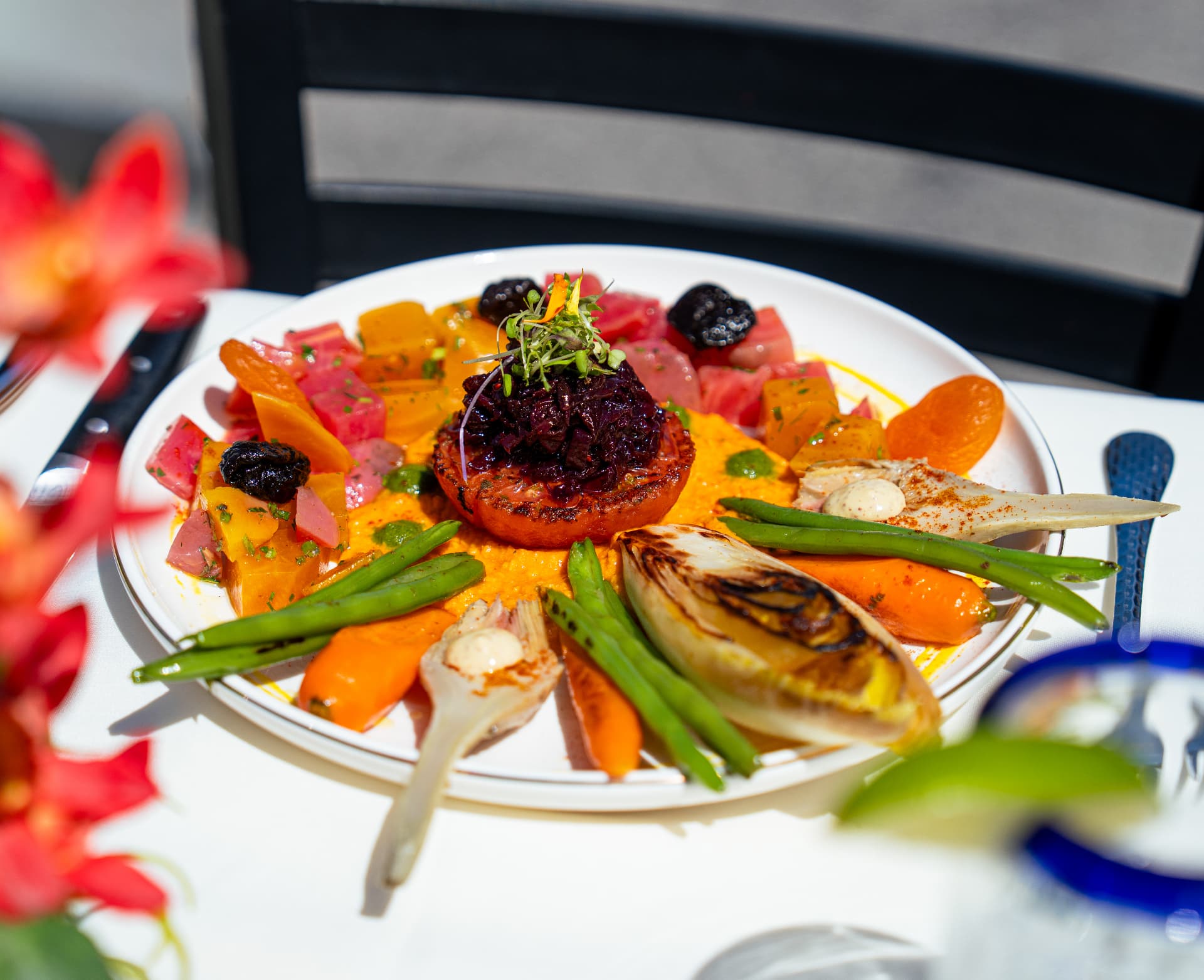 A colorful roasted vegetable platter with beets, green beans and endive